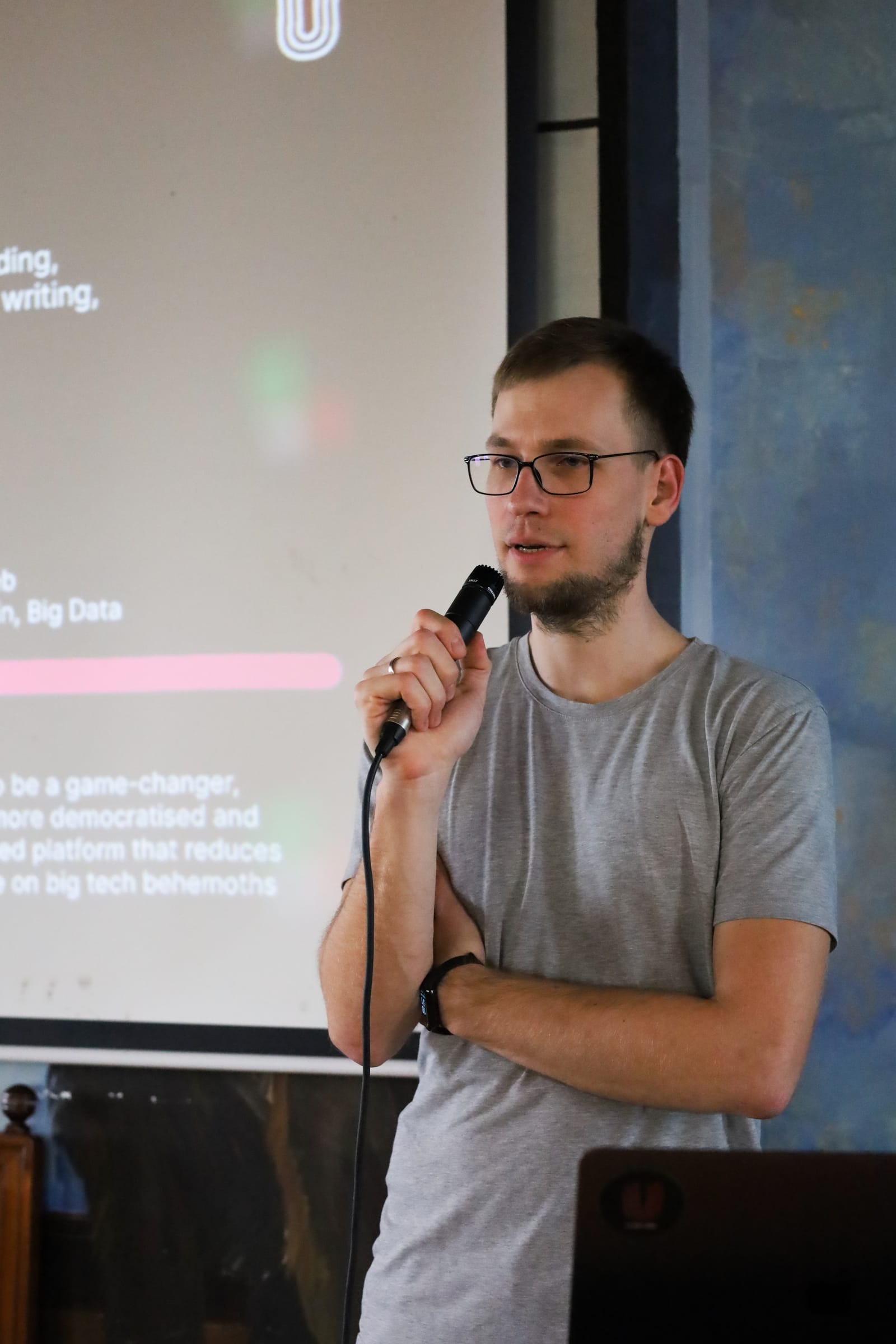 Team member with microphone at a company event