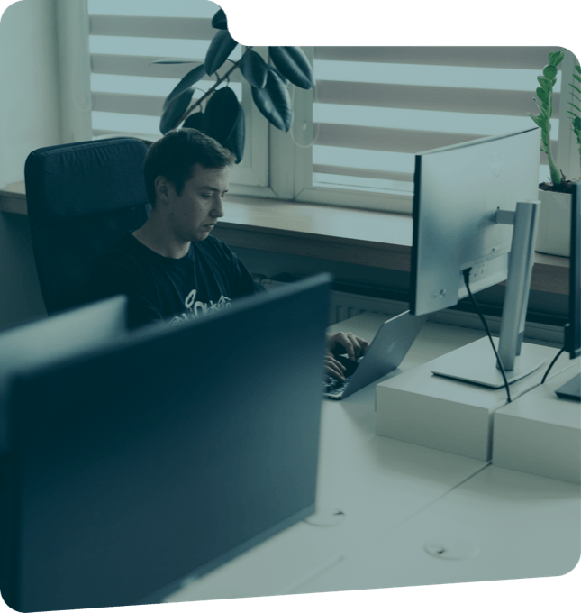 ULAM LABS engineer cleaning up a vibe-coded codebase at a workstation